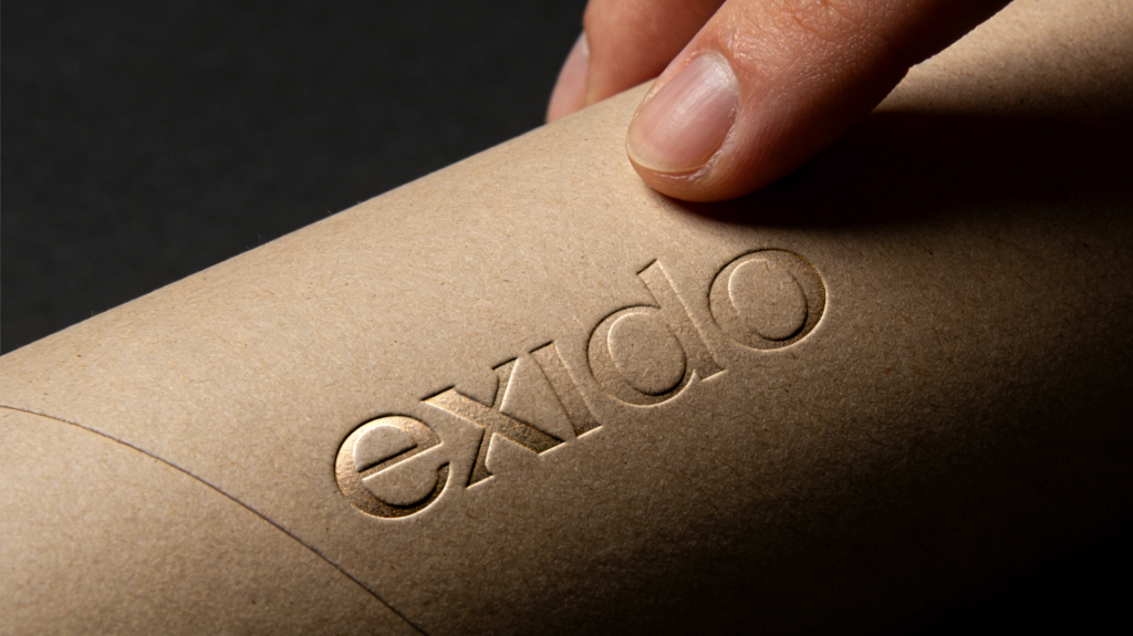Debossed design on paper tube packaging