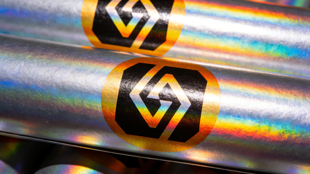Glossy finish paper tube packaging with vibrant colors 